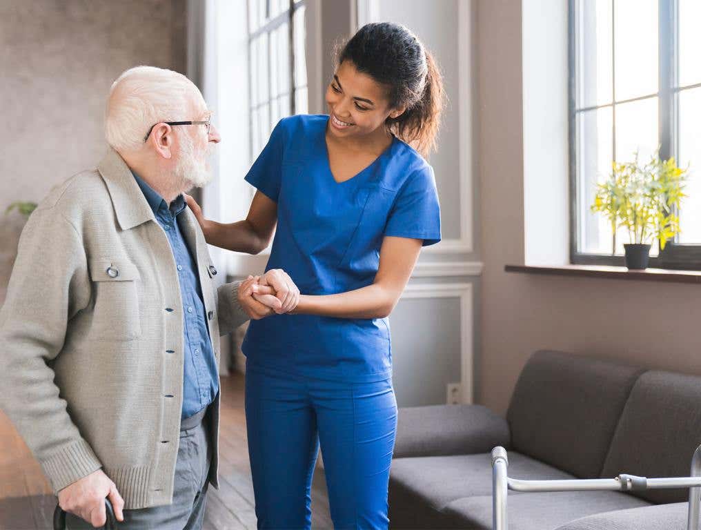 Consolidation of Augusta VA Medical Centers - woman helping elderly man