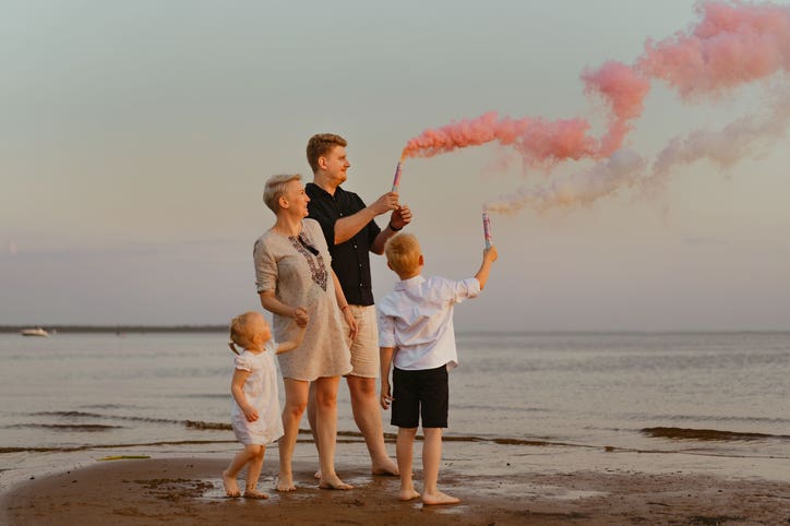 Gender reveal announcement on the beach.