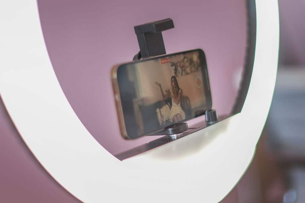 Mari Juliette, the owner of Mari Juliette Real Estate, produces a real estate TikTok broadcast in her office on April 26, 2024, in Pompano Beach, Florida.